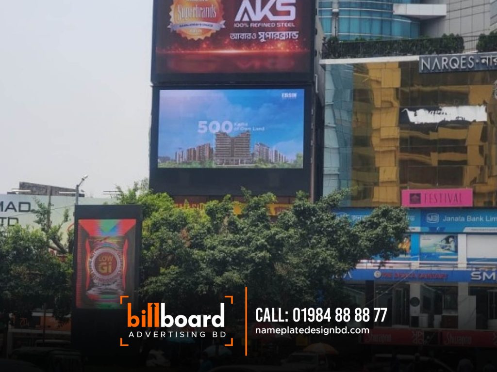 Product Branding Media Agency Bangladesh, Our LED advertising boards are strategically placed in key locations across Bangladesh, ensuring maximum exposure and reaching a wide audience. In Dhaka, our billboards can be found in prominent areas such as Gulshan 1, Gulshan 2, Bashundhara, Banani, Baridhara, Mirpur, Mohakhali, Shahbag, Tejgaon, and Shadarghat. We also extend our reach to other major cities, including Rajshahi, Chittagong, Cox Bazar, Sylhet, Mymensingh, and more. What sets us apart is our commitment to cutting-edge technology and creative excellence. Our LED billboards feature advanced displays that deliver vibrant colors, sharp resolution, and optimal visibility even in various lighting conditions. We have a dedicated team of skilled designers and content managers who work closely with businesses to create captivating visuals and compelling content that effectively communicates their brand message. We take pride in our extensive coverage across Bangladesh. We leave no stone unturned when it comes to reaching your target audience, as we cover all major places and cities throughout the country. From the vibrant streets of Dhaka to the cultural hubs of Chittagong and Rajshahi, and from the scenic landscapes of Cox’s Bazar to the enchanting city of Sylhet, our advertising services span across every corner of Bangladesh. Whether you’re looking to promote your brand in bustling urban centers or capture the attention of audiences in smaller towns, our comprehensive coverage ensures that your message reaches far and wide. With our commitment to delivering impactful LED advertising campaigns, you can rest assured that your brand will be seen and remembered in every corner of Bangladesh.